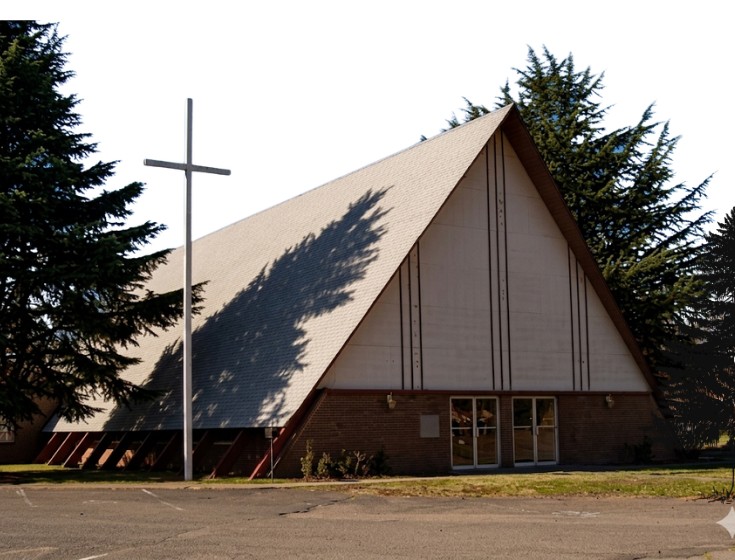 Word of Life Faith Church building exterior with a cross, located in Birmingham, Alabama