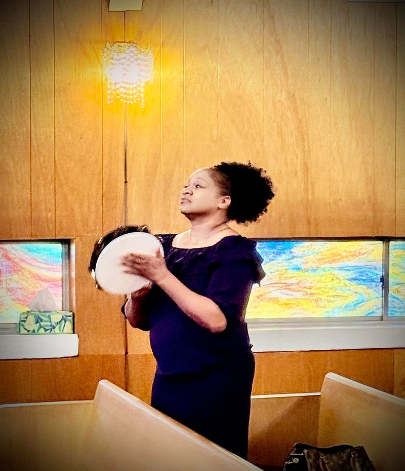 Praise and worship with tambourine at Word of Life Faith Church